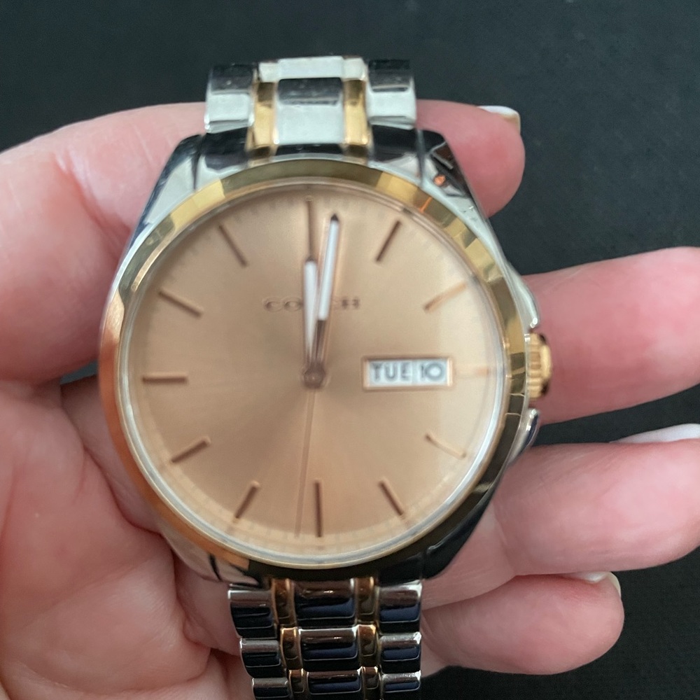 Beautiful Coach rose gold and stainless steel watch. Really cool watch.